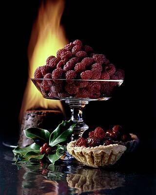 Black Background Wall Art featuring the photograph Raspberries In A Glass Serving Dish With Tarts by  Fotiades