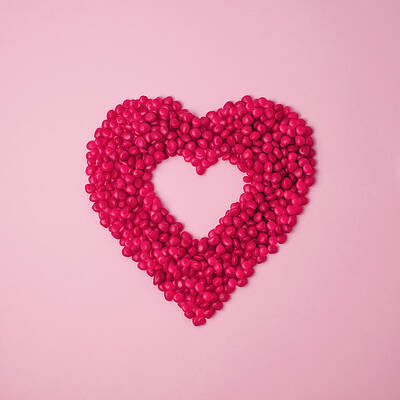 Wall Art featuring the photograph Red Cinnamon Candies In The Shape Of A by Juj Winn