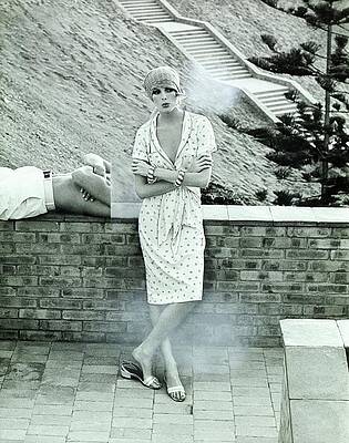 Landscape Architecture Wall Art featuring the photograph Rene Russo Wearing A Short-sleeved Print Dress by Henry Clarke