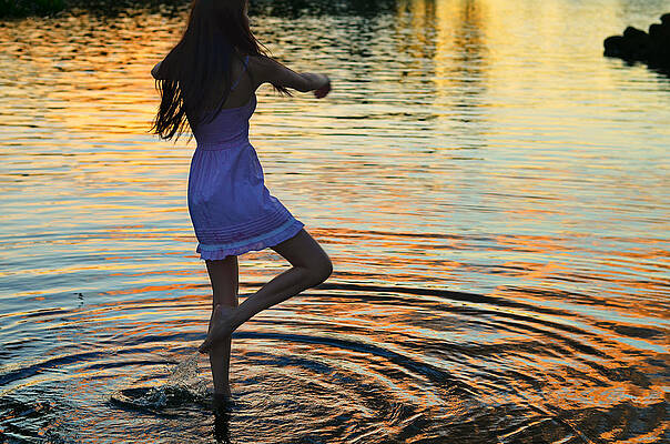 Dancing in the Water at Sunset Wall Art