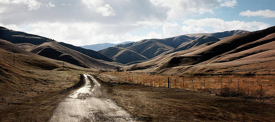 Wall Art featuring the photograph Rural Road Into Hilly Country by Ed Freeman