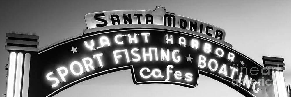 California Wall Art featuring the photograph Santa Monica Pier Sign Panoramic Black And White Photo by Paul Velgos
