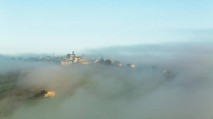 Wall Art featuring the photograph Small Italian Village In The Fog by Deimagine