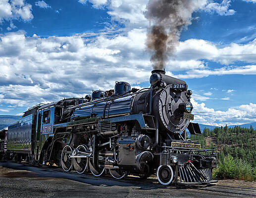 Majestic Steam Locomotive Under Blue Skies Photograph
