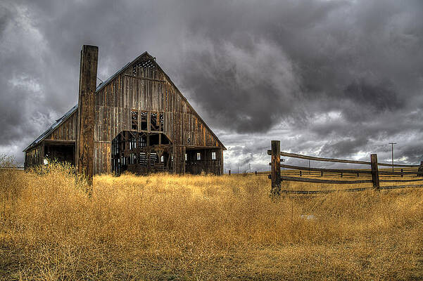 Dramatic Wall Art featuring the photograph Storm Over Abandoned Barn by Jean Noren