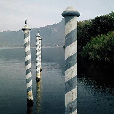 Striped Poles in Serene Lake Wall Art