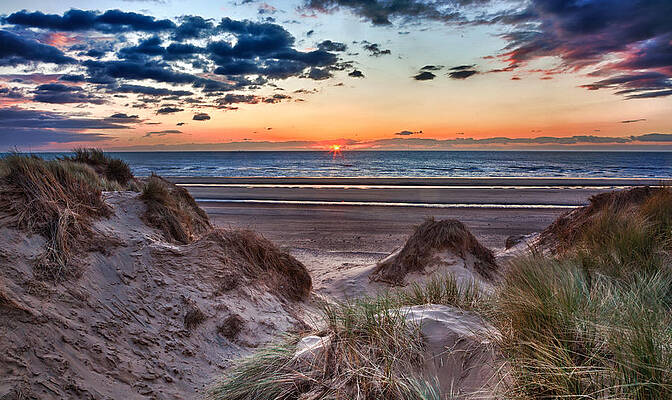 Water Wall Art featuring the photograph Sunset Over Formby Beach Through Dunes by Steven Heap