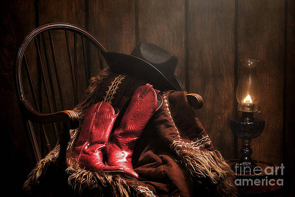 Cowboy Boots and Hat by Lantern Photograph