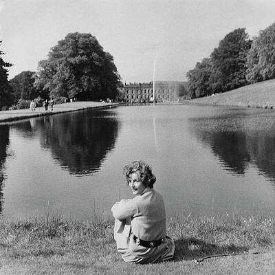 Woman by a Tranquil Lake Wall Art