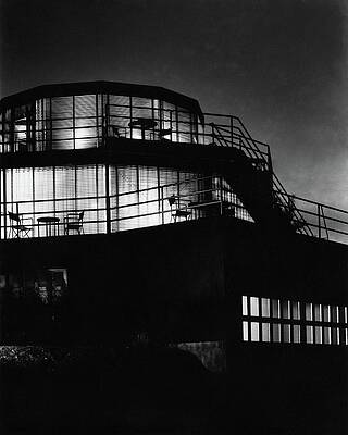 Staircase Photograph - The Exterior Of A Spiral House Design At Night by Eugene Hutchinson