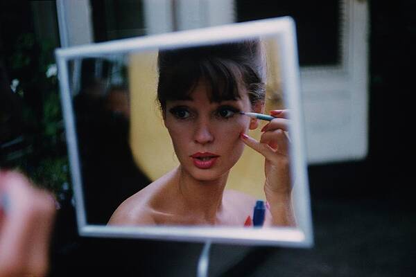Woman Applying Makeup in Mirror Wall Art
