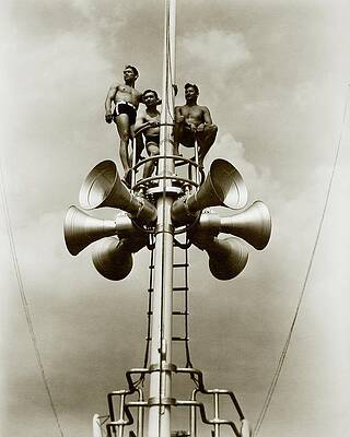 Men on Loudspeaker Tower Photograph