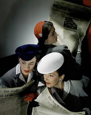 Women Reading Newspapers in Fashionable Hats Photograph