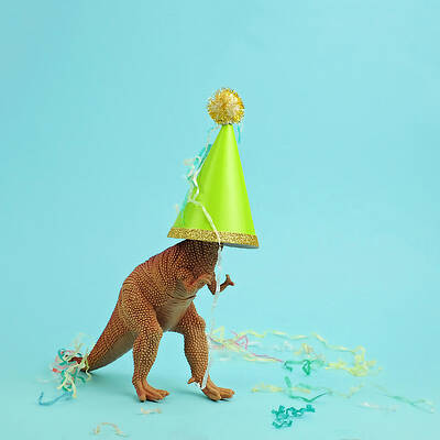 Wall Art featuring the photograph Toy Dinosaur Wearing A Party Hat by Juj Winn
