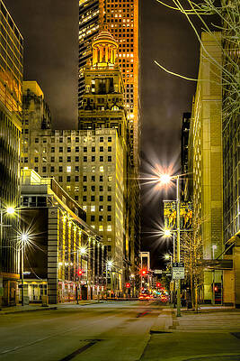 Nighttime Cityscape with Illuminated Tower Photograph