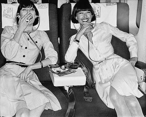 Watching Photograph - Two Models Laughing At A Movie In An Iberia 747 by Chris von Wangenheim