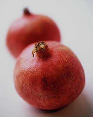 Fruit Photograph - Two Pomegranates by Romulo Yanes