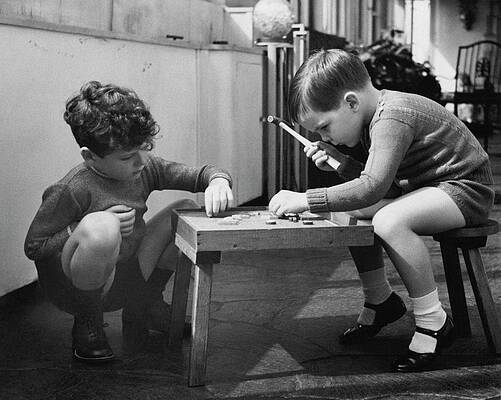 6 Wall Art featuring the photograph Two Young Boys Sitting By A Wooden Table by Remie Lohse