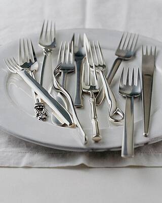 Assorted Forks on White Plate Photograph