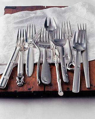 Fork Wall Art featuring the photograph Various Forks On A Wooden Board by Romulo Yanes