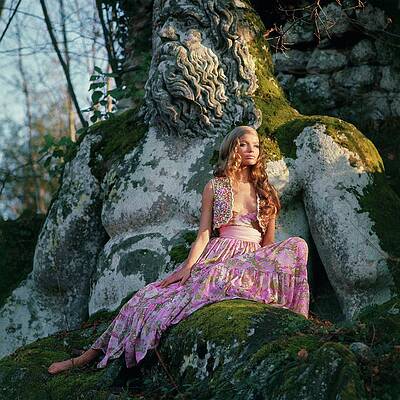Woman Posing with Ancient Mossy Statue Print