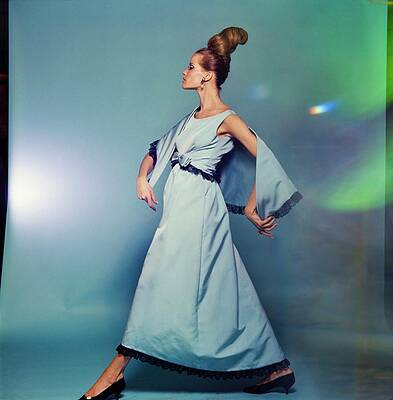 Walking Photograph - Veruschka Wearing Mollie Parnis by Bert Stern