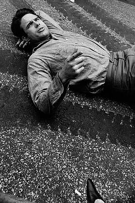 Man Relaxing on Pavement Photograph