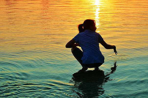 Silhouette of a Woman at Sunset Wall Art