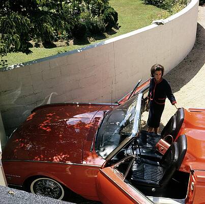 Vintage Convertible and Stylish Woman Photograph