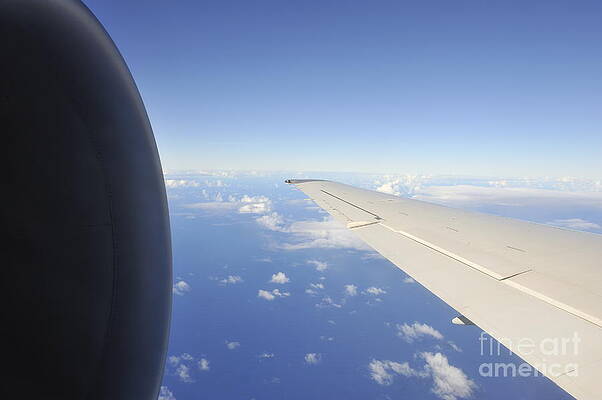 Transportation Wall Art featuring the photograph Wing And Jet Engine Of Airplane Flying Over Ocean by Sami Sarkis Photography