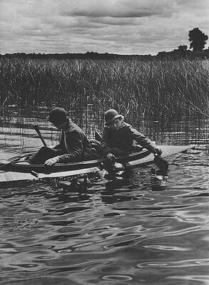 Canoeing Adventure Through Marshlands Photograph