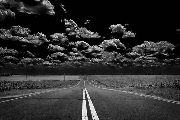 Black And White Wall Art featuring the photograph A Long Dark Road by Bill and Linda Tiepelman