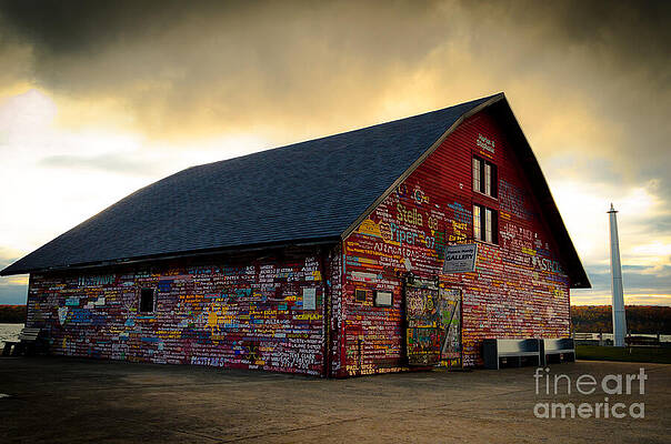 Colorful Barn Against Stormy Sky Wall Art