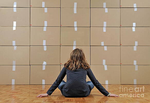 Child Sitting in Front of Boxes Wall Art