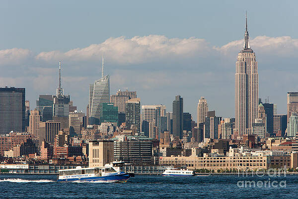 Wall Art featuring the photograph Manhattan Skyline And Ferry Traffic by Clarence Holmes