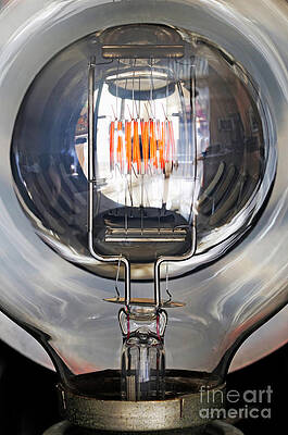 Close Up Photograph - Red Filament Inside Illuminated Light Bulb by Sami Sarkis Photography
