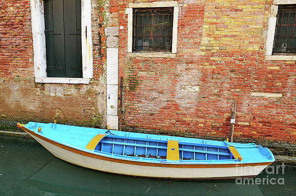 Transportation Wall Art featuring the photograph Row Boat By Old Bricks Wall And Canal by Sami Sarkis Photography