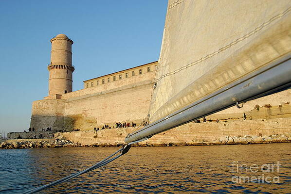 Nobody Photograph - Sailboat Navigating By Fort Saint Jean At Sunset by Sami Sarkis Photography