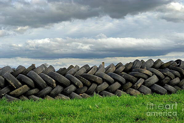 Cloud Photograph - Stack Of Used Tires In Green Field by Sami Sarkis Photography