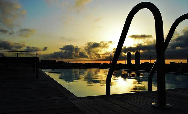 Water Wall Art featuring the photograph Sunrise Over Poolside by La Dolce Vita