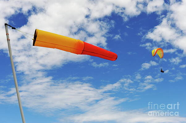 Cloud Photograph - Windsock And Paraglider In The Air by Sami Sarkis Photography