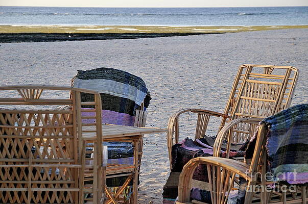 Beach Wall Art featuring the photograph Wooden Chairs On  Beach At Sunrise by Sami Sarkis Photography