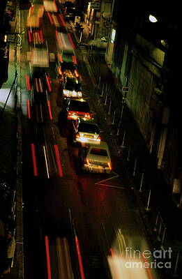 Transportation Wall Art featuring the photograph Cars Travelling Along A Street During A Rainy Night by Sami Sarkis Photography