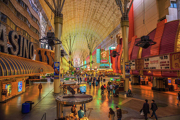 Tourism Wall Art featuring the photograph Fremont Street With Many Neon Lights And Tourists In Las Vegas by Miroslav Liska