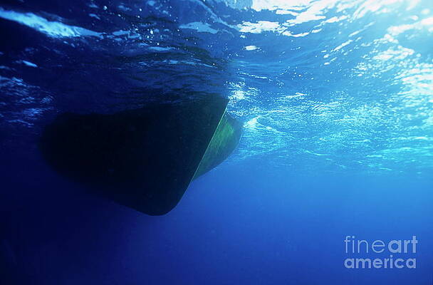 Transportation Wall Art featuring the photograph Hull Of A Boat Is Seen From Underwater by Sami Sarkis Photography