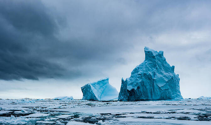 Wall Art featuring the photograph Icy Monoliths - Antarctica Iceberg Photograph by Duane Miller