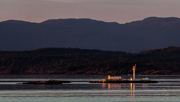 Photograph - Isolated Lighthouse by Ed Clark