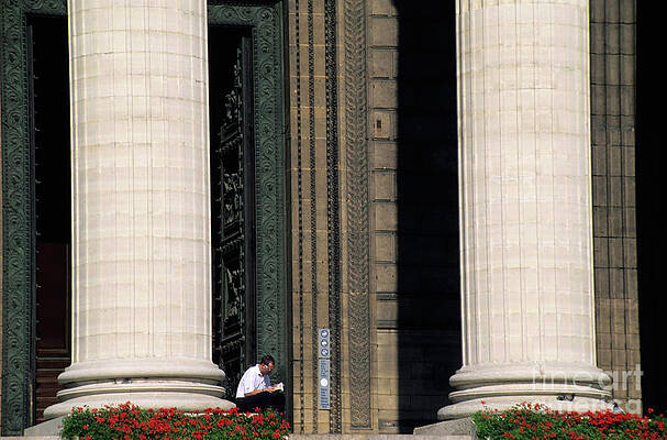 Wall Art featuring the photograph Man Reading A Book Beside The Columns Of La Madeleine Church In Paris by Sami Sarkis Photography
