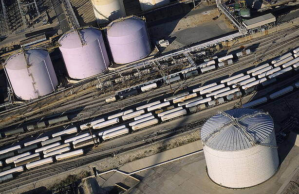 Europe Photograph - Oil Tank And Trains On Railroad Tracks by Sami Sarkis Photography