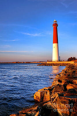 Majestic Red Lighthouse at Sunset Photograph